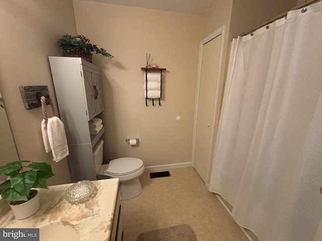 21 Moby Dick Dr, Ocean Pines, MD 21811 - full bathroom featuring toilet, vanity, baseboards, and a shower with shower curtain