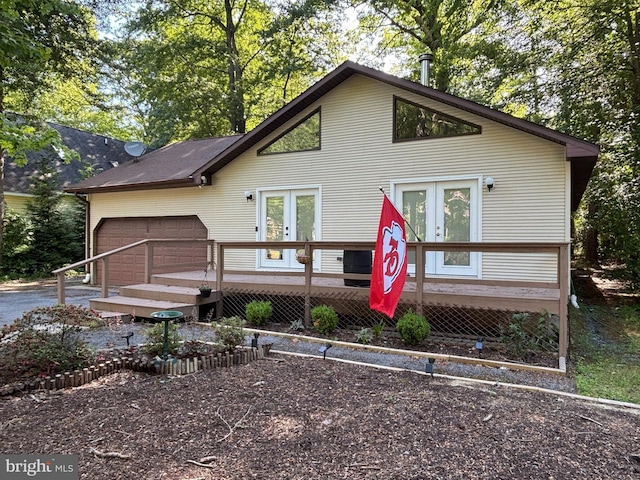 21 Moby Dick Dr, Ocean Pines, MD 21811 - view of front of home with french doors, a wooden deck, and a garage