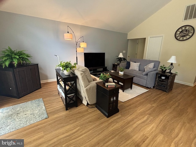 21 Moby Dick Dr, Ocean Pines, MD 21811 - living area featuring baseboards, light wood-type flooring, and high vaulted ceiling