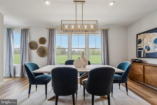 dining space featuring a chandelier, light wood-style floors, and recessed lighting