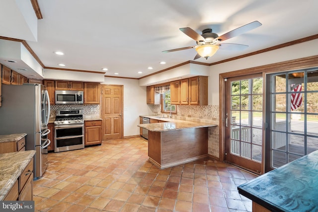 4 Bessie Ct, Millstone Township, NJ 08535 - kitchen featuring stainless steel appliances, ornamental molding, backsplash, brown cabinetry, and a ceiling fan