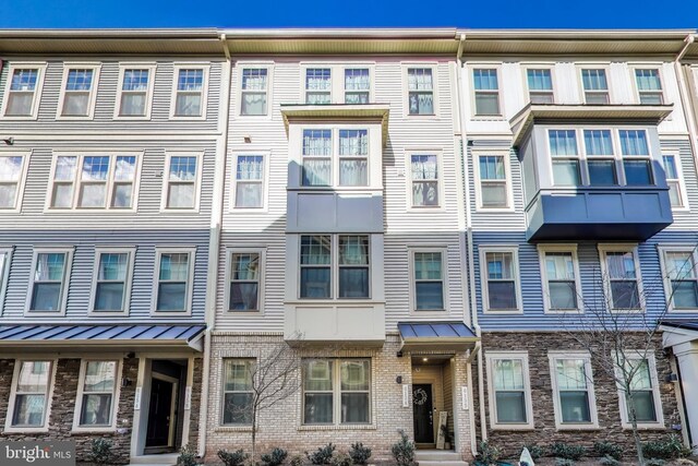 613 Percy Pl # B, Manassas Park, VA 20111 - view of property with a standing seam roof