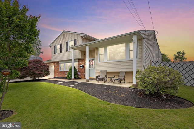 24 Holyoke Dr, Delran, NJ 08075 - rear view of house featuring a lawn and brick siding