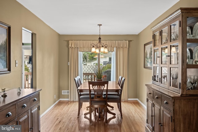 24 Holyoke Dr, Delran, NJ 08075 - dining area with a chandelier, light wood-style flooring, and plenty of natural light