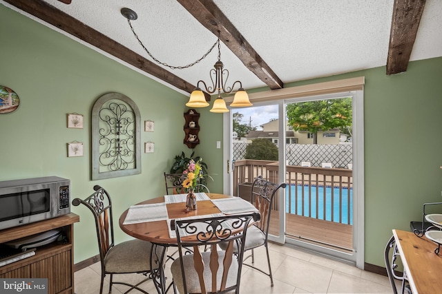 24 Holyoke Dr, Delran, NJ 08075 - dining space with beam ceiling, baseboards, a textured ceiling, and light tile patterned floors
