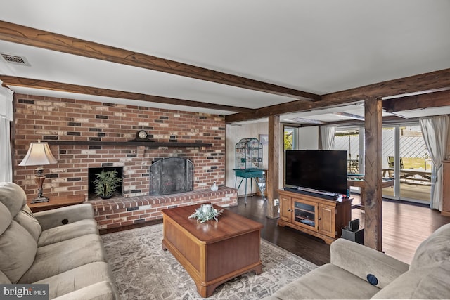 24 Holyoke Dr, Delran, NJ 08075 - living area featuring a brick fireplace, wood finished floors, and beamed ceiling