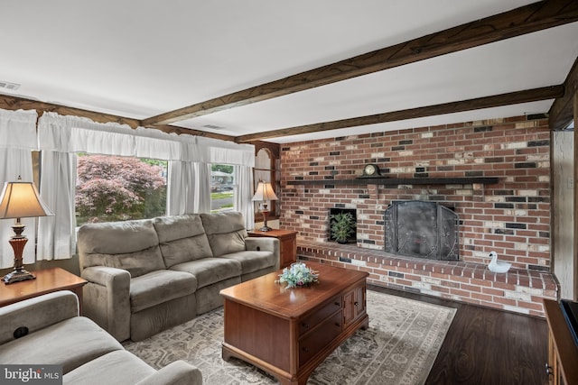 24 Holyoke Dr, Delran, NJ 08075 - living area featuring wood finished floors, beamed ceiling, and a brick fireplace