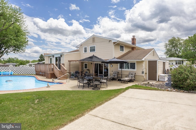 24 Holyoke Dr, Delran, NJ 08075 - back of house featuring a chimney and a patio