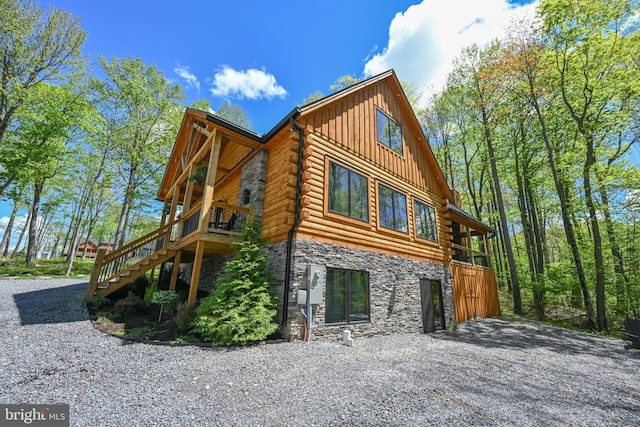 1067 N Camp Rd, Mc Henry, MD 21541 - view of home's exterior with stone siding, board and batten siding, log siding, and stairs