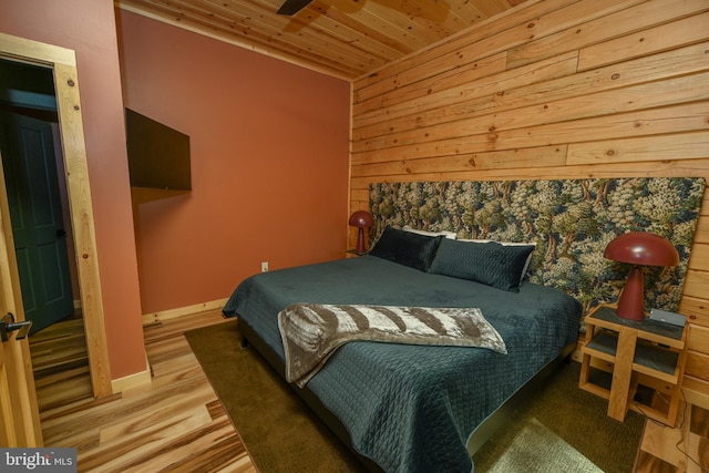 1067 N Camp Rd, Mc Henry, MD 21541 - bedroom featuring wooden ceiling, wooden walls, wood finished floors, and baseboards