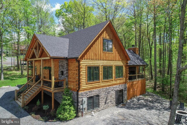 1067 N Camp Rd, Mc Henry, MD 21541 - view of front of house with stone siding, board and batten siding, a chimney, log siding, and a shingled roof