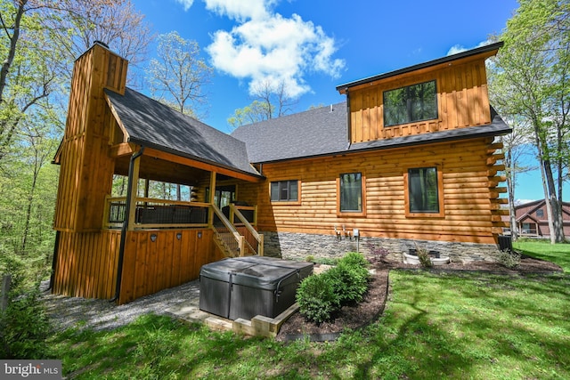 1067 N Camp Rd, Mc Henry, MD 21541 - back of house featuring a hot tub, a chimney, log siding, a lawn, and board and batten siding