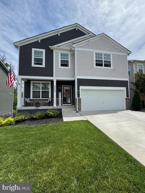 5809 Zoe Ln, Frederick, MD 21704 - view of front of property with a porch, a garage, concrete driveway, and a front lawn
