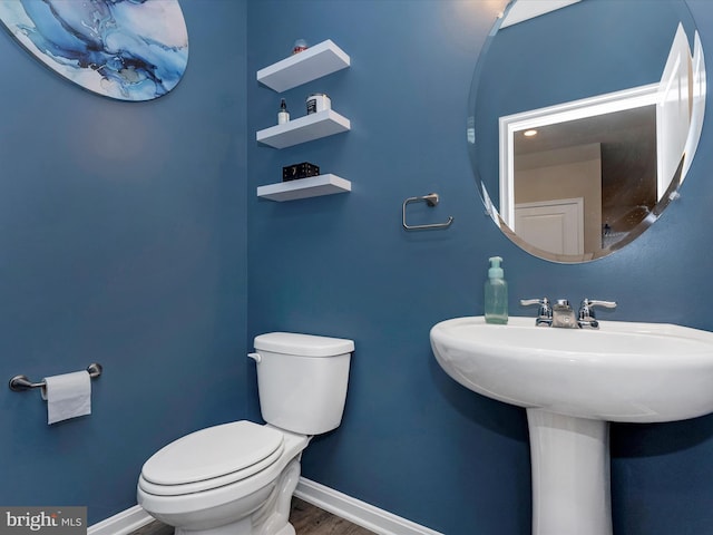 5809 Zoe Ln, Frederick, MD 21704 - bathroom featuring toilet, baseboards, wood finished floors, and a sink