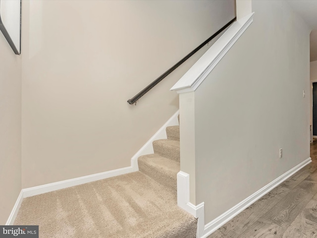 5809 Zoe Ln, Frederick, MD 21704 - staircase featuring baseboards and wood finished floors