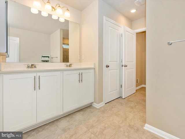 5809 Zoe Ln, Frederick, MD 21704 - full bathroom with double vanity, baseboards, and tile patterned floors