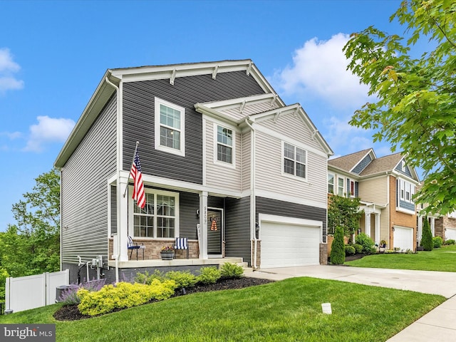 5809 Zoe Ln, Frederick, MD 21704 - view of front facade with covered porch, driveway, and an attached garage