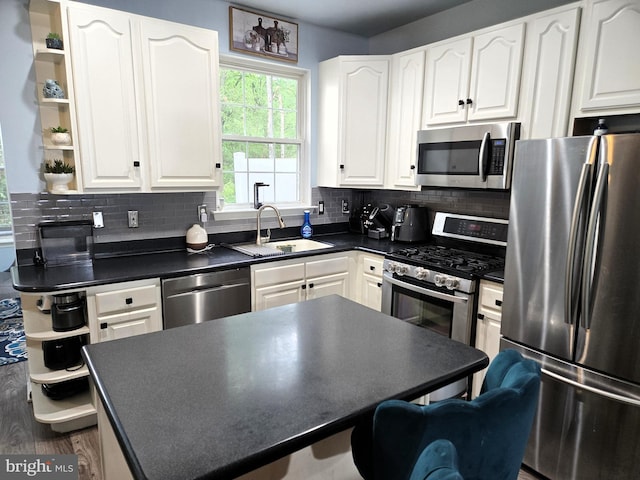 7832 Canter Ct, Severn, MD 21144 - kitchen featuring appliances with stainless steel finishes, open shelves, a sink, and dark countertops