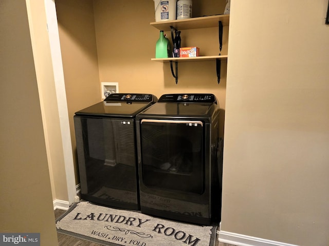7832 Canter Ct, Severn, MD 21144 - laundry area with washing machine and clothes dryer, baseboards, and wood finished floors