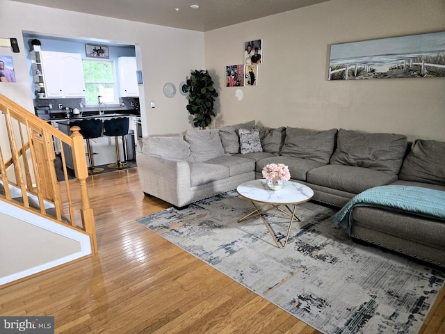 7832 Canter Ct, Severn, MD 21144 - living area with light wood-style floors and stairway
