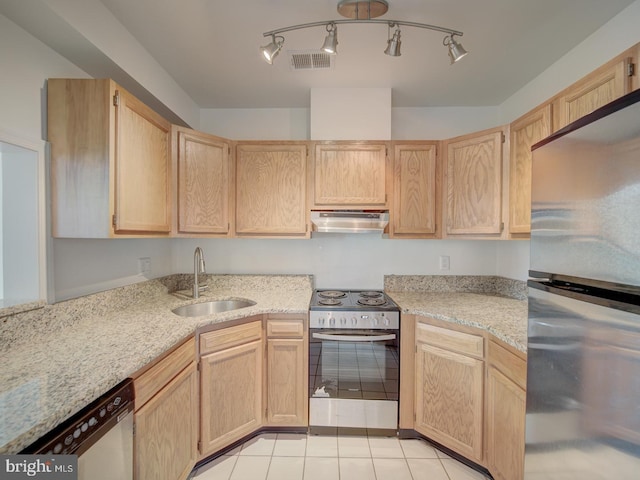 1812 Vernon St NW Unit 42, Washington, DC 20009 - kitchen with stainless steel appliances, a sink, under cabinet range hood, light brown cabinets, and light tile patterned flooring