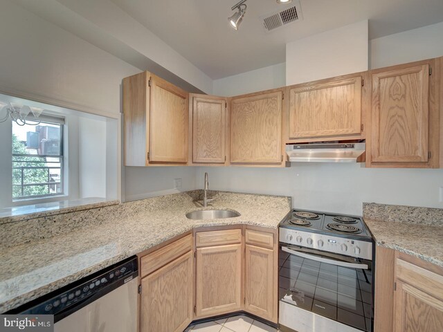 1812 Vernon St NW Unit 42, Washington, DC 20009 - kitchen with appliances with stainless steel finishes, a sink, under cabinet range hood, light brown cabinets, and light stone counters