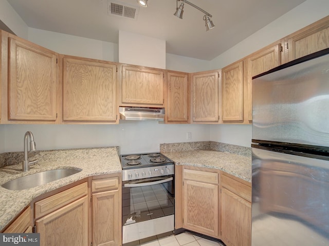 1812 Vernon St NW Unit 42, Washington, DC 20009 - kitchen featuring stainless steel appliances, a sink, under cabinet range hood, and light brown cabinets