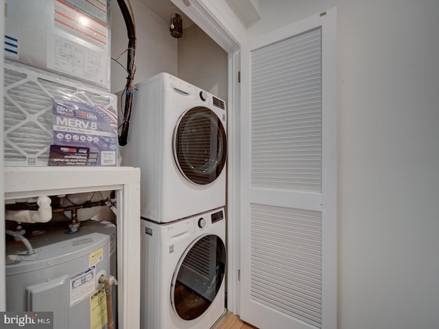 1812 Vernon St NW Unit 42, Washington, DC 20009 - laundry room featuring stacked washer / dryer and water heater