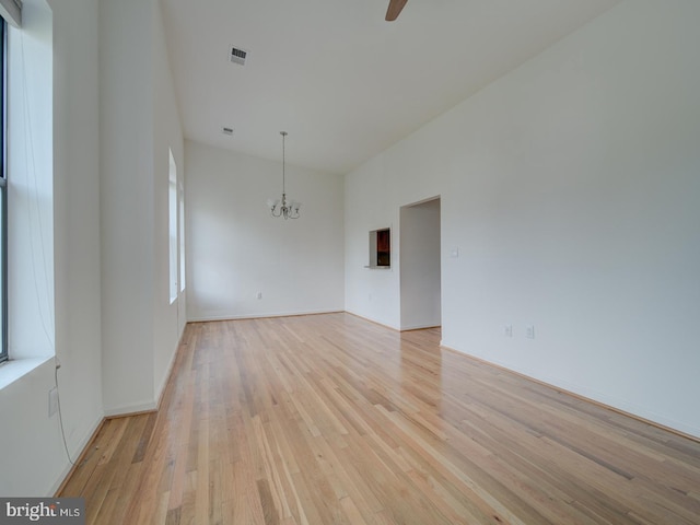 1812 Vernon St NW Unit 42, Washington, DC 20009 - unfurnished room with a chandelier, light wood-style floors, and ceiling fan