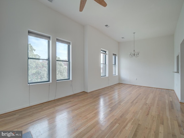 1812 Vernon St NW Unit 42, Washington, DC 20009 - spare room featuring light wood-style floors, a chandelier, ceiling fan, and baseboards