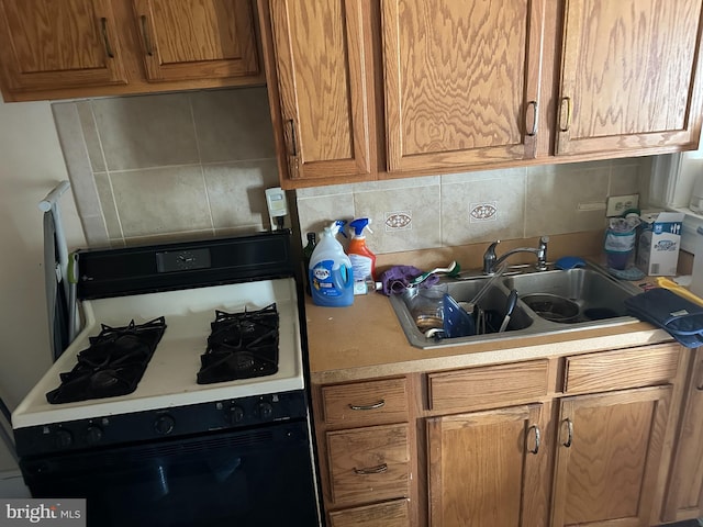 1533 N Carolina Ave NE, Washington, DC 20002 - kitchen with gas range, light countertops, tasteful backsplash, and brown cabinets