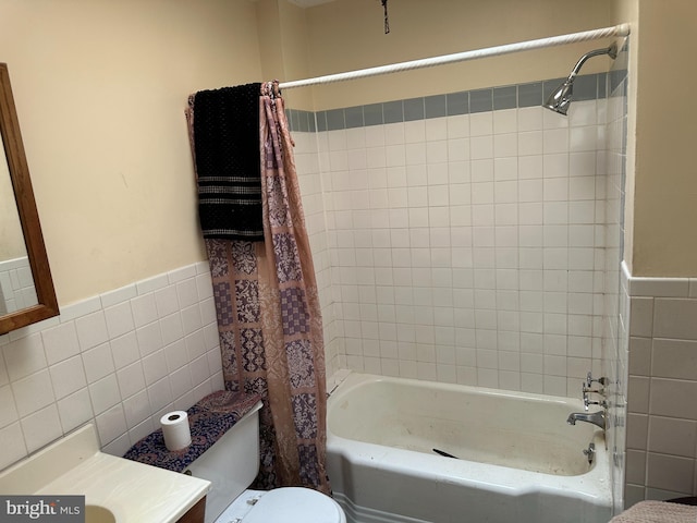 1533 N Carolina Ave NE, Washington, DC 20002 - bathroom with tile walls, shower / tub combo with curtain, vanity, and a wainscoted wall