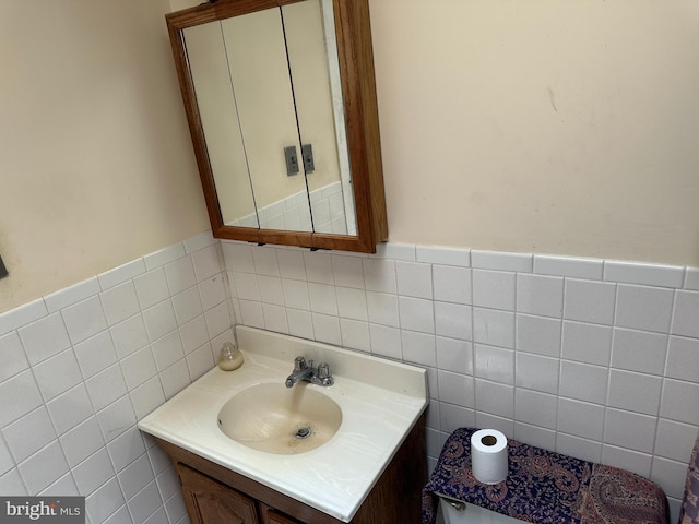 1533 N Carolina Ave NE, Washington, DC 20002 - half bath featuring tile walls, vanity, and a wainscoted wall