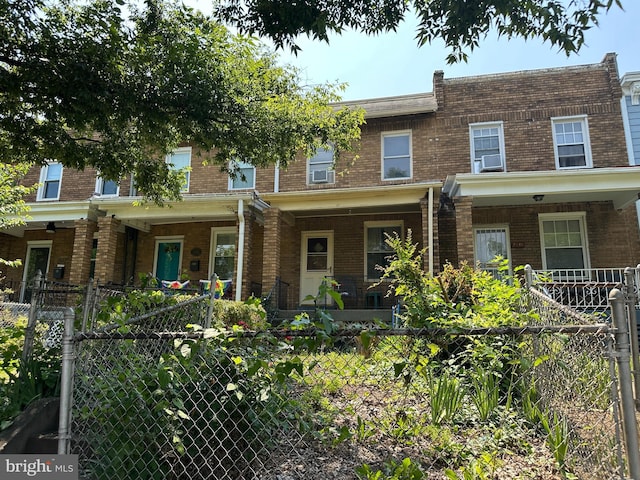 1533 N Carolina Ave NE, Washington, DC 20002 - multi unit property featuring brick siding, a porch, and a fenced front yard