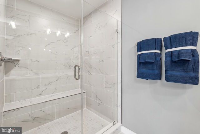 bathroom with a shower stall