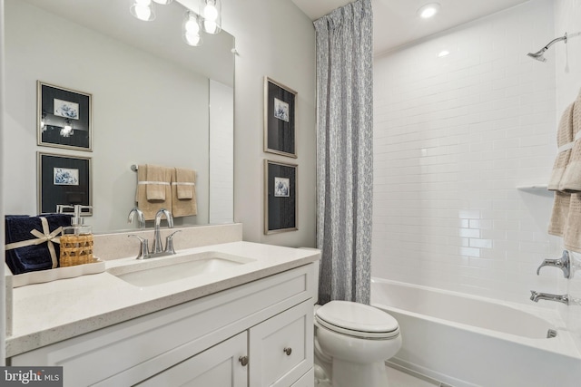 full bath featuring shower / bath combo, toilet, and vanity