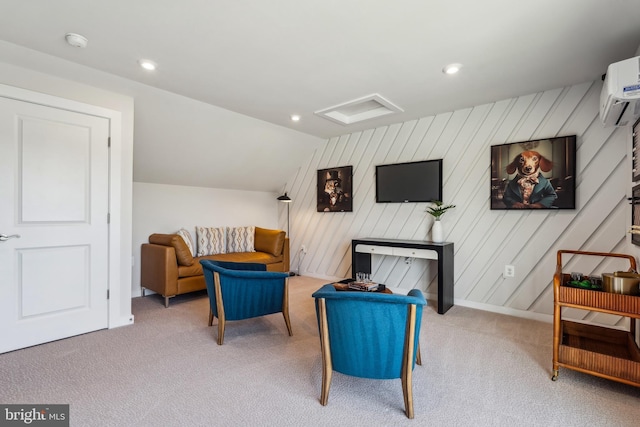 living area with carpet, an AC wall unit, lofted ceiling, attic access, and recessed lighting