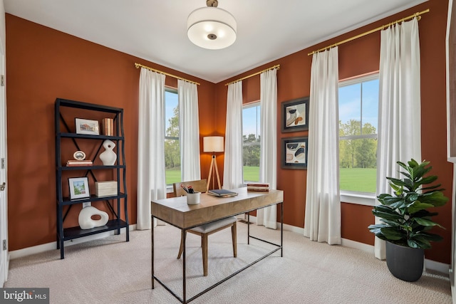 office featuring light colored carpet and baseboards