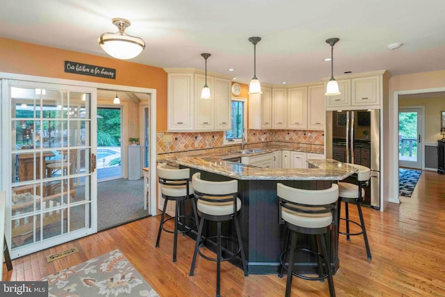 3097 Mill Rd, Doylestown, PA 18902 - kitchen with freestanding refrigerator, a sink, light stone countertops, tasteful backsplash, and recessed lighting