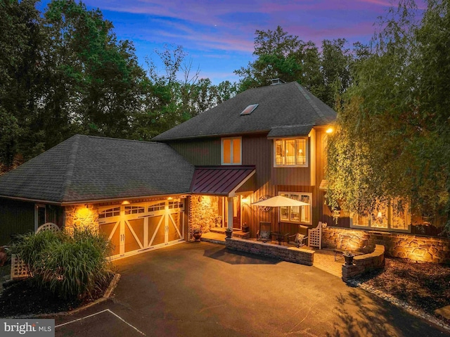 3097 Mill Rd, Doylestown, PA 18902 - view of front facade featuring a standing seam roof, stone siding, roof with shingles, asphalt driveway, and an attached garage