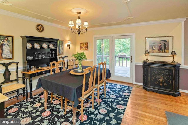3097 Mill Rd, Doylestown, PA 18902 - dining space featuring ornamental molding, wood finished floors, and a chandelier
