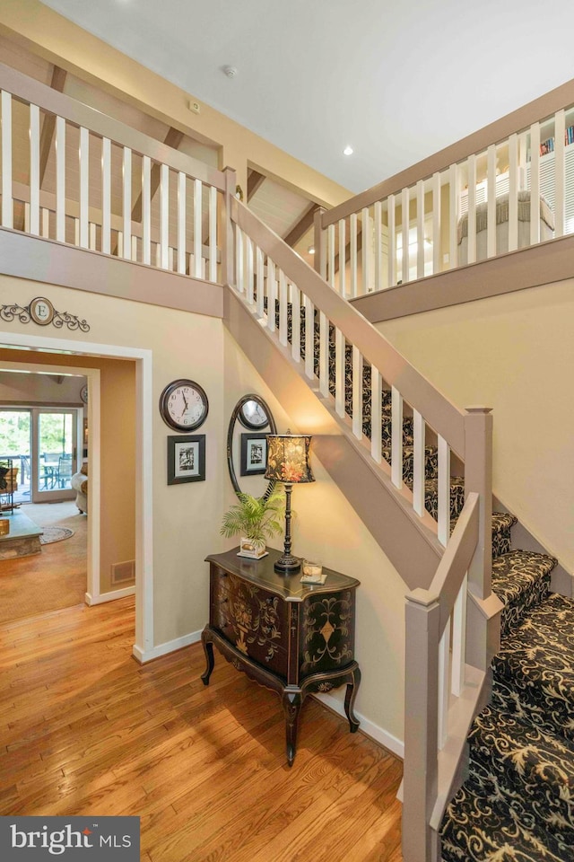 3097 Mill Rd, Doylestown, PA 18902 - stairs featuring wood finished floors, baseboards, a towering ceiling, and recessed lighting