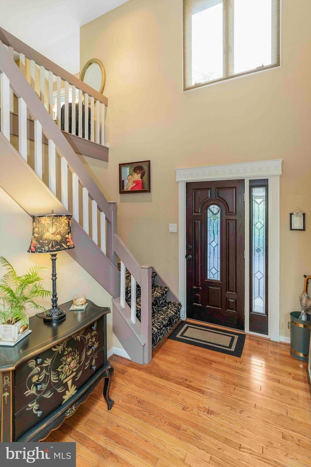 3097 Mill Rd, Doylestown, PA 18902 - foyer with a towering ceiling, stairway, and wood finished floors