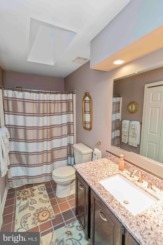 3097 Mill Rd, Doylestown, PA 18902 - full bathroom featuring toilet, vanity, a skylight, tile patterned floors, and a shower with curtain