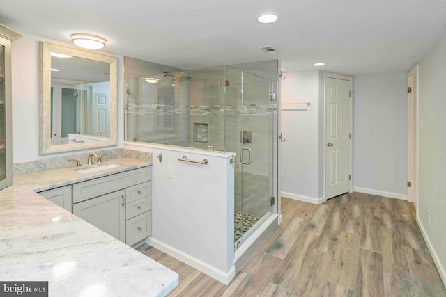 3097 Mill Rd, Doylestown, PA 18902 - bathroom featuring vanity, a shower stall, wood finished floors, baseboards, and recessed lighting