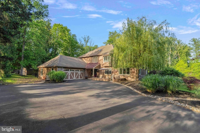 3097 Mill Rd, Doylestown, PA 18902 - view of front of home with asphalt driveway and a garage