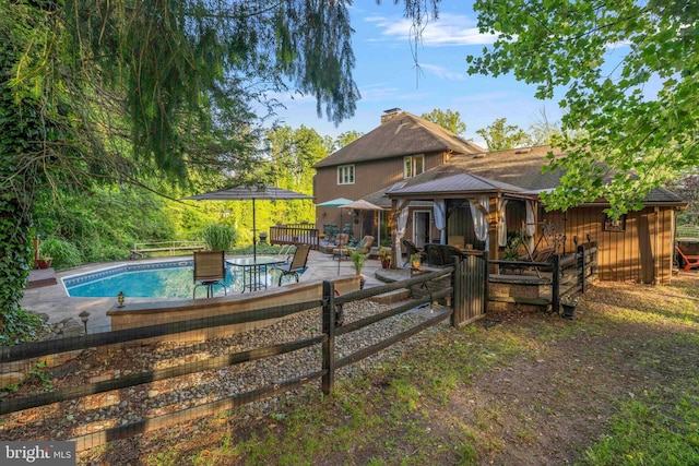 3097 Mill Rd, Doylestown, PA 18902 - rear view of house with a gazebo, a patio, and a chimney