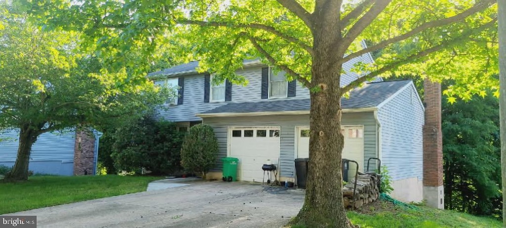 view of front of house with an attached garage and driveway