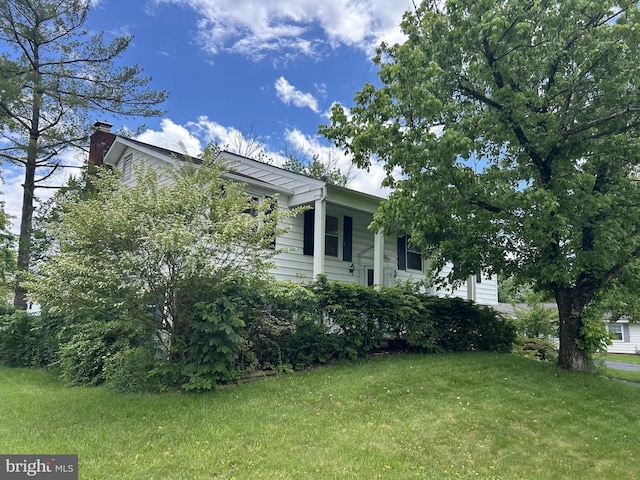 4205 Middle Ridge Dr, Fairfax, VA 22033 - view of property exterior with a yard and a chimney