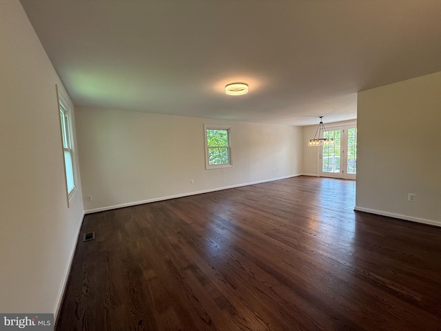 4205 Middle Ridge Dr, Fairfax, VA 22033 - unfurnished room with a chandelier, healthy amount of natural light, dark wood-style flooring, and baseboards